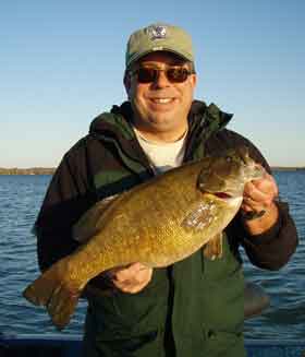 cameraguy boats a huge Mullett Lake smallmouth bass on a tube bait October 9 2008 cameraguy boats a huge Mullett Lake smallmouth bass on a tube bait October 9 2008