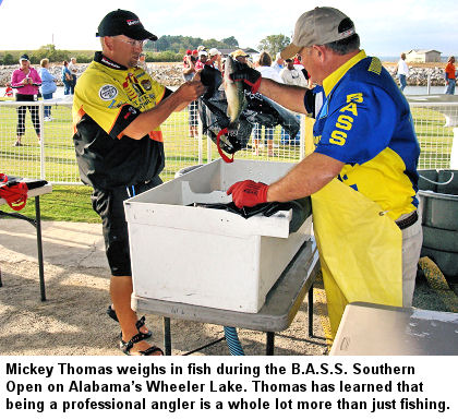 Mickey Thomas weighs in fish during the B.A.S.S. Southern Open on Alabama’s Wheeler Lake. Thomas has learned that being a professional angler is a whole lot more than just fishing.