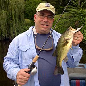 Mark cameraguy Gomez with his biggest largemouth bass of the day from the Grand River in Lansing Mark cameraguy Gomez with his biggest largemouth bass of the day from the Grand River in Lansing