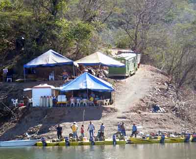 Excellent shore lunch and siesta for everyone at the Lake Comedero shore camp each day at noon. Excellent shore lunch and siesta for everyone at the Lake Comedero shore camp each day at noon.