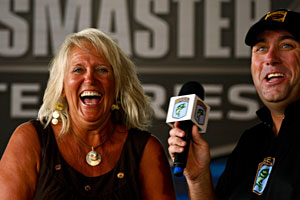 All-Star week fan finalist boat winner Cynthia Ryan of Farmerville Louisiana celebrates with B.A.S.S. emcee Dave Mercer All-Star week fan finalist boat winner Cynthia Ryan of Farmerville Louisiana celebrates with B.A.S.S. emcee Dave Mercer