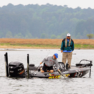 Greg Vinson lands a big bass during bass tournament competition Greg Vinson lands a big bass during bass tournament competition