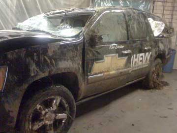 Driver side view of Kim Stricker's Team Chevy Suburban after his rollover accident in December 2008