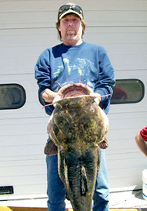 Rodney Akey with his record-setting catch 49.8 pounds flathead catfish from the St Joseph River in Michigan Rodney Akey with his record-setting catch 49.8 pounds flathead catfish from the St Joseph River in Michigan