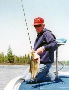 Larry Dekker with a big Clam Lake largemouth bass