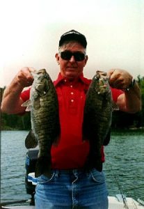 Larry with 2 slab Northern Michigan smallmouth.