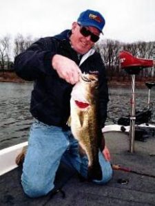 Larry Dekker with a big largemouth bass that ate a Bomber Shallow A