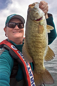 Snap-jigging excels at attracting and catching quality size smallmouth bass like this nice fish from Little Muscamoot Bay Lake St. Clair.