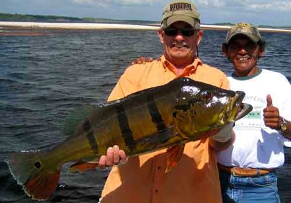 Background Dave Gizzi huge peacock bass 24 1/2 pounds with Iggy 1/23/2010