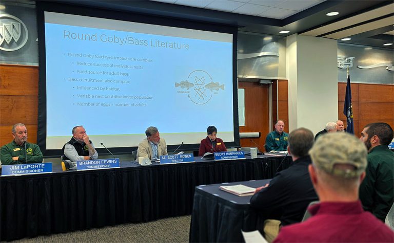 Dr. Lucas Nathan and Michigan Fisheries Chief Randy Claramunt present bass and goby science to the Michigan Natural Resources Commission on November 6, 2025.