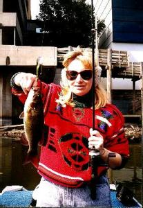 She’s my wife & she can catch ‘em too. This decent smallie came almost out from under Michigan Ave in downtown Lansing.