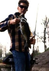 Dan Launstein with a Thornapple Lake crankbait smallie – a bruiser trailing several broken lines.