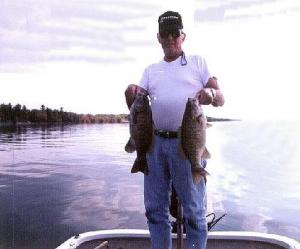 Larry hefts two big fall smallies caught on an Indian summer day in the fall where the big ones were biting all day.