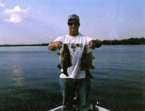 Me with 2 more full-grown Northern Michigan smallies from a past opening weekend trip where prespawn smallie were marauding.