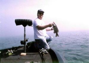 Boating a decent smallie in the middle of nowhere is common on the Great Lakes. No shore in sight in this photo.