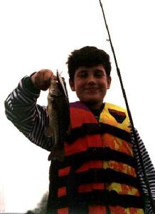 ‘Little’ Nic with a L. Ovid largemouth caught twitching a Rapala.