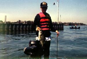 A young Nic with a well-fed largemouth from a Lake St. Clair marina seawall. A smart photographer would use fill-flash, but the bass were biting.