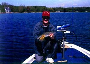 Larry snapped my pretty little rainbow trout I caught on a jerkbait from a Northern Michigan lake.