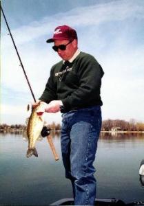 Derek unhooks a decent largemouth that fell for a double-willow spinnerbait.