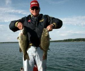 Larry Dekker with 2 more big northern Michigan smallies from a fall weekend to remember. Larry passed away in 2006.